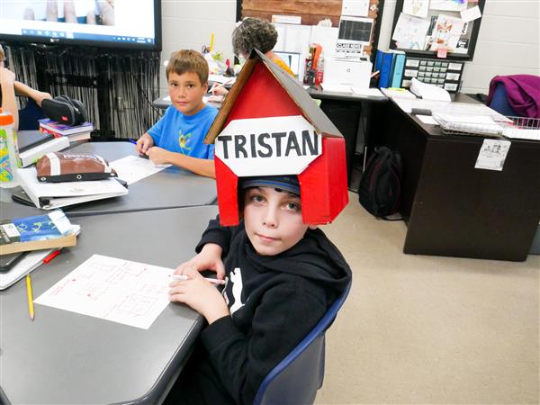 Fifth Graders putting on a Pun Fashion Show.